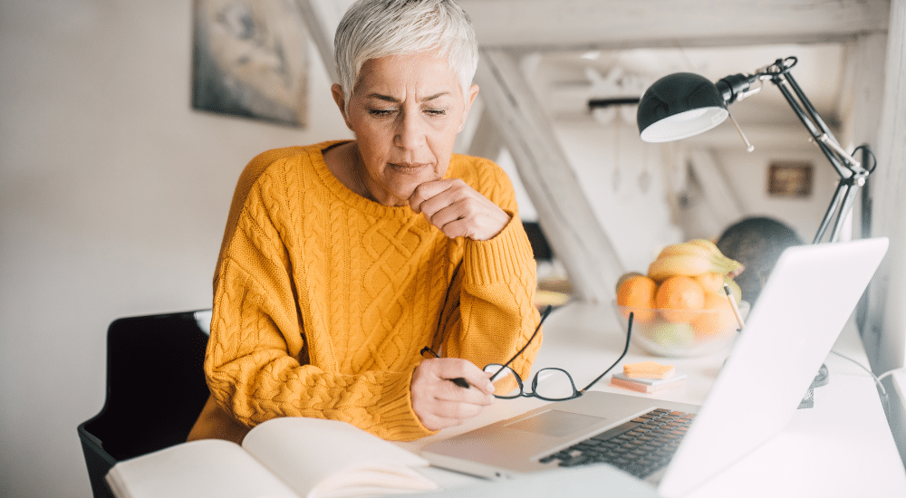 Woman looking at laptop