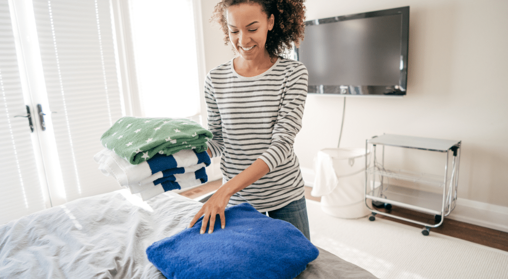 Woman folding towels